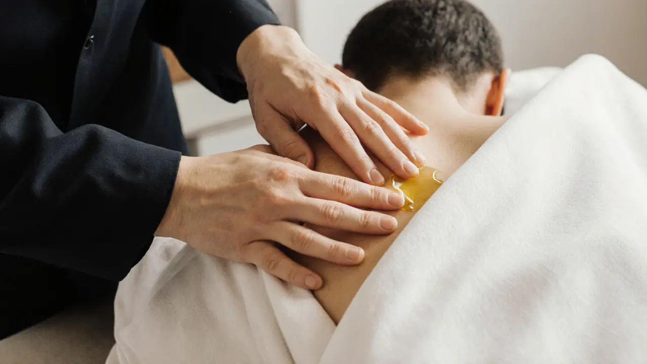 Therapist working on a client&#039;s back with proper draping